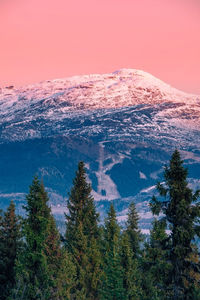 High angle view of snowcapped mountain against sky during sunset