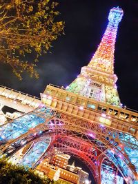 Low angle view of illuminated lit up at night