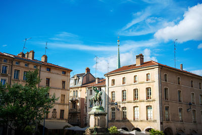 Buildings in city against sky