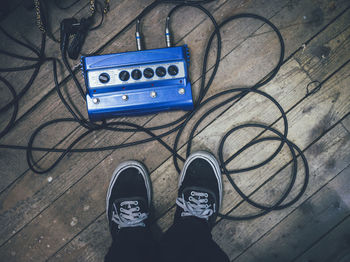 Man standing next to musical equipment