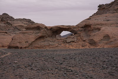 Rock formations in desert against sky