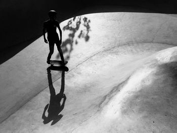 High angle view of man walking on footpath