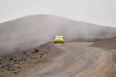 Car on land against sky