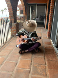 Rear view of woman walking on footpath