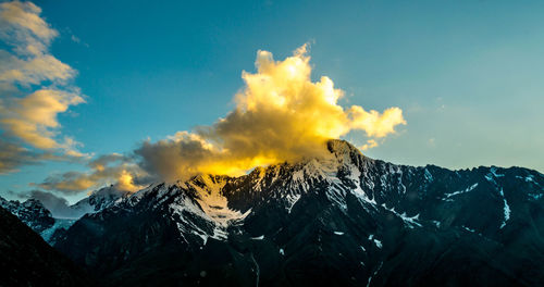 Scenic view of snowcapped mountains against sky