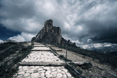 Low angle view of castle on mountain against sky