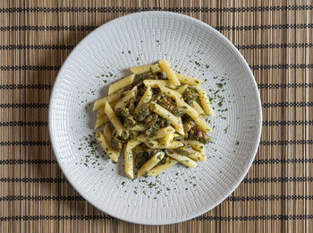 A plate of pasta with mushroom sauce