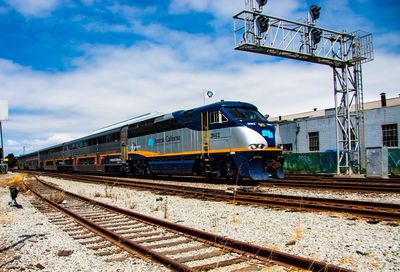 Train on railroad tracks against sky