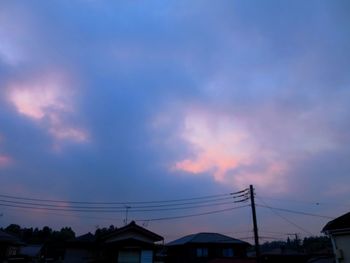 Low angle view of silhouette buildings against sky during sunset