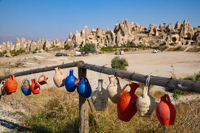 Panoramic view of clothes hanging on rock against sky