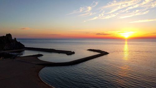 Scenic view of sea against sky during sunset