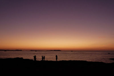 Scenic view of sea against clear sky during sunset