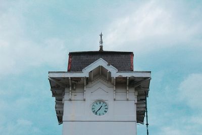 Low angle view of clock tower against sky