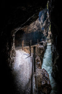 Scenic view of river seen through cave