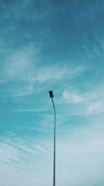 Low angle view of street light against sky