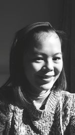 Close-up portrait of smiling young woman