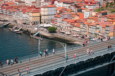 High angle view of people on bridge over river in porto portugal