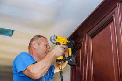 Close-up of man working at home