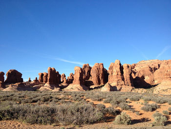 Scenic view of rock formations against clear sky