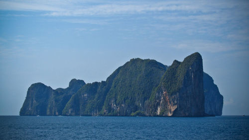 Scenic view of mountains and sea against sky