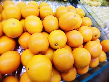 Close-up of oranges for sale at market stall