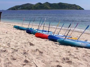Row of canoes at beach