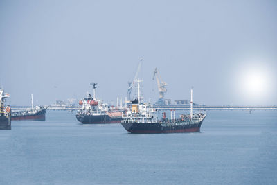 Ship in sea against sky