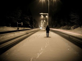 Woman walking on road