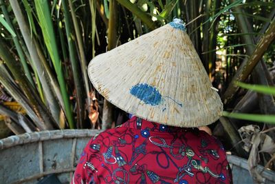 Rear view of person against plants