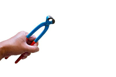 Close-up of hand holding hands over white background