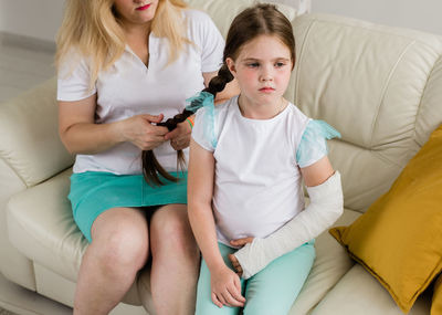 Doctor examining patient at home