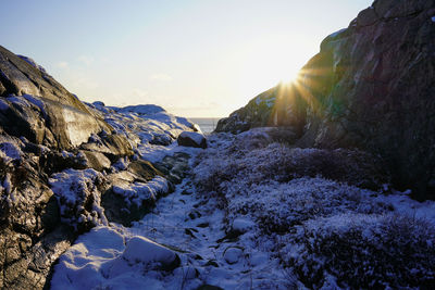 Scenic view of snowcapped mountains against sky during sunset