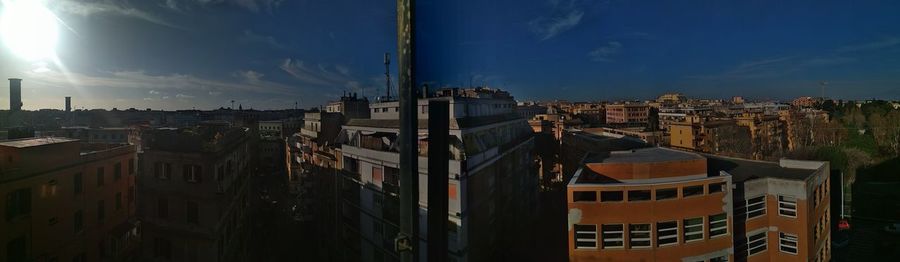 High angle view of buildings in town against sky