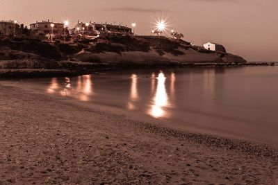 Scenic view of sea against sky at night
