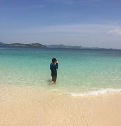 Full length of man on beach against sky