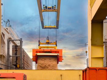 Low angle view of yellow building against sky