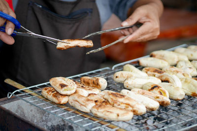 Midsection of man preparing food