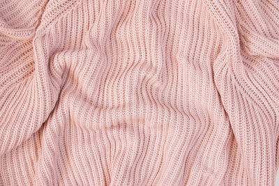 Texture of pink fabric. background with folds. close-up.