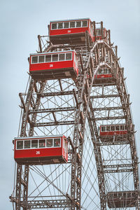 Low angle view of ferris wheel against sky