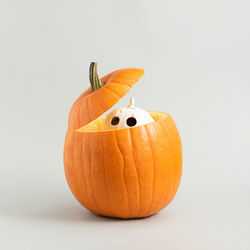 Orange pumpkins against white background