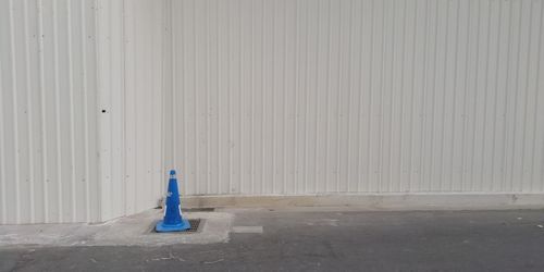 View of blue metal wall in city