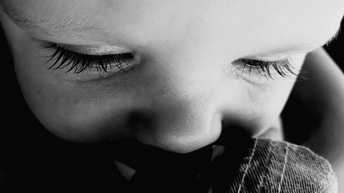 Close-up of baby boy crying while looking down