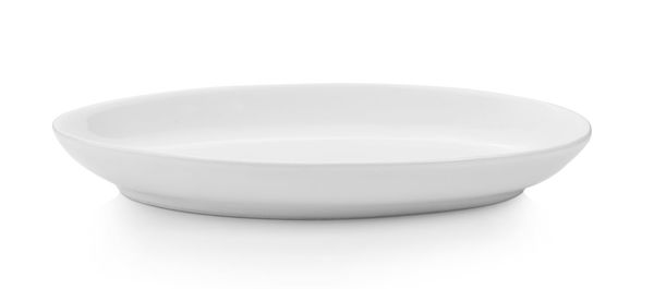 Close-up of empty bowl over white background