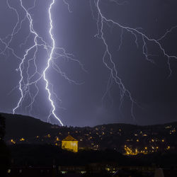 Lightning over city at night