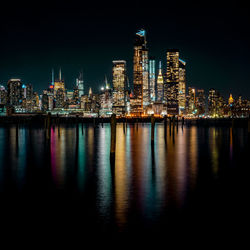 Illuminated buildings in city at night