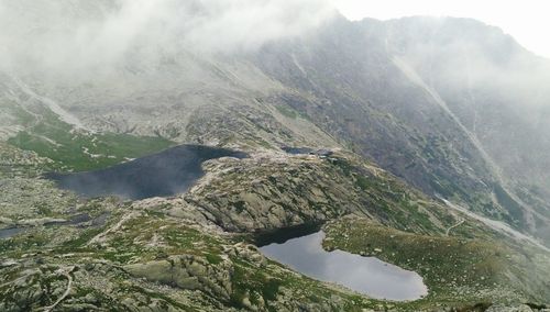 Scenic view of lake with mountains in background