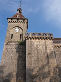 Low angle view of bell tower against sky