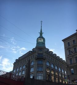 Low angle view of buildings against blue sky