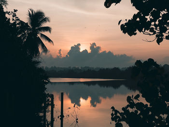 Scenic view of lake against sky during sunset