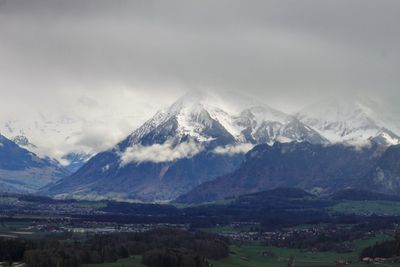 Scenic view of snowcapped mountains against sky